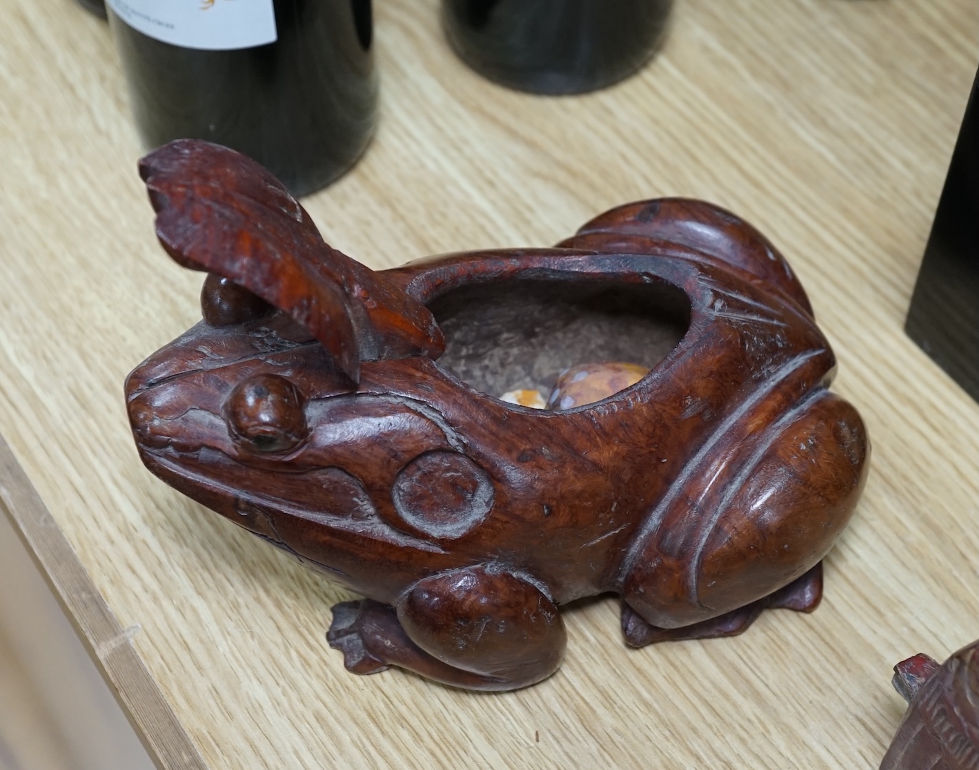 A carved painted South East Asian figure on stand, lacquered wood figures and carvings and a carved frog box, painted figure 50cm high. Condition - mixed, poor to fair